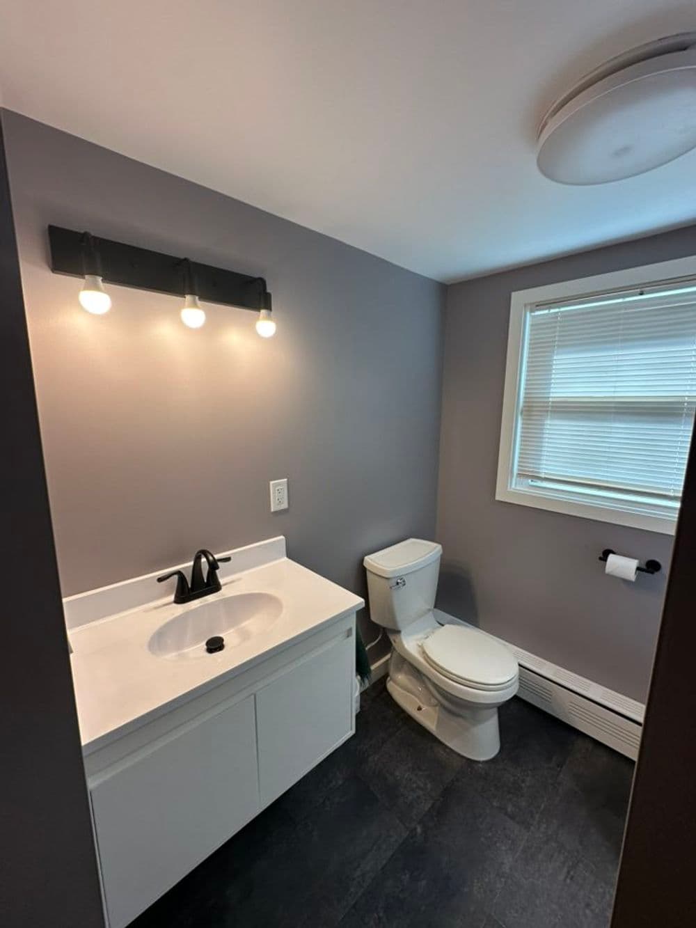 Bathroom Transformation Featuring Tiled Shower and Luxury Vinyl Floor in Sterling CT