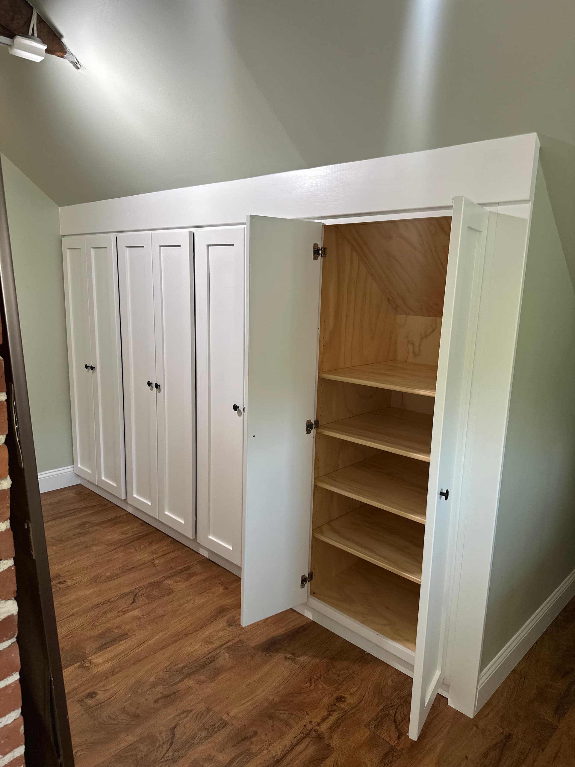 Gallery photos for Custom Built-In Cabinetry Designed for a Tricky Sloped Ceiling Space: Image #1